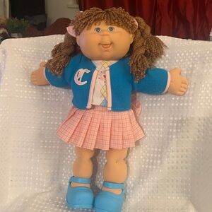 Cute Cabbage Patch Kid,with brown braids and blue eyes, in original outfit.